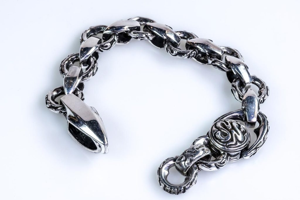 Silver bracelet with snakes and arrows