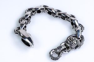 Silver bracelet with snakes and arrows